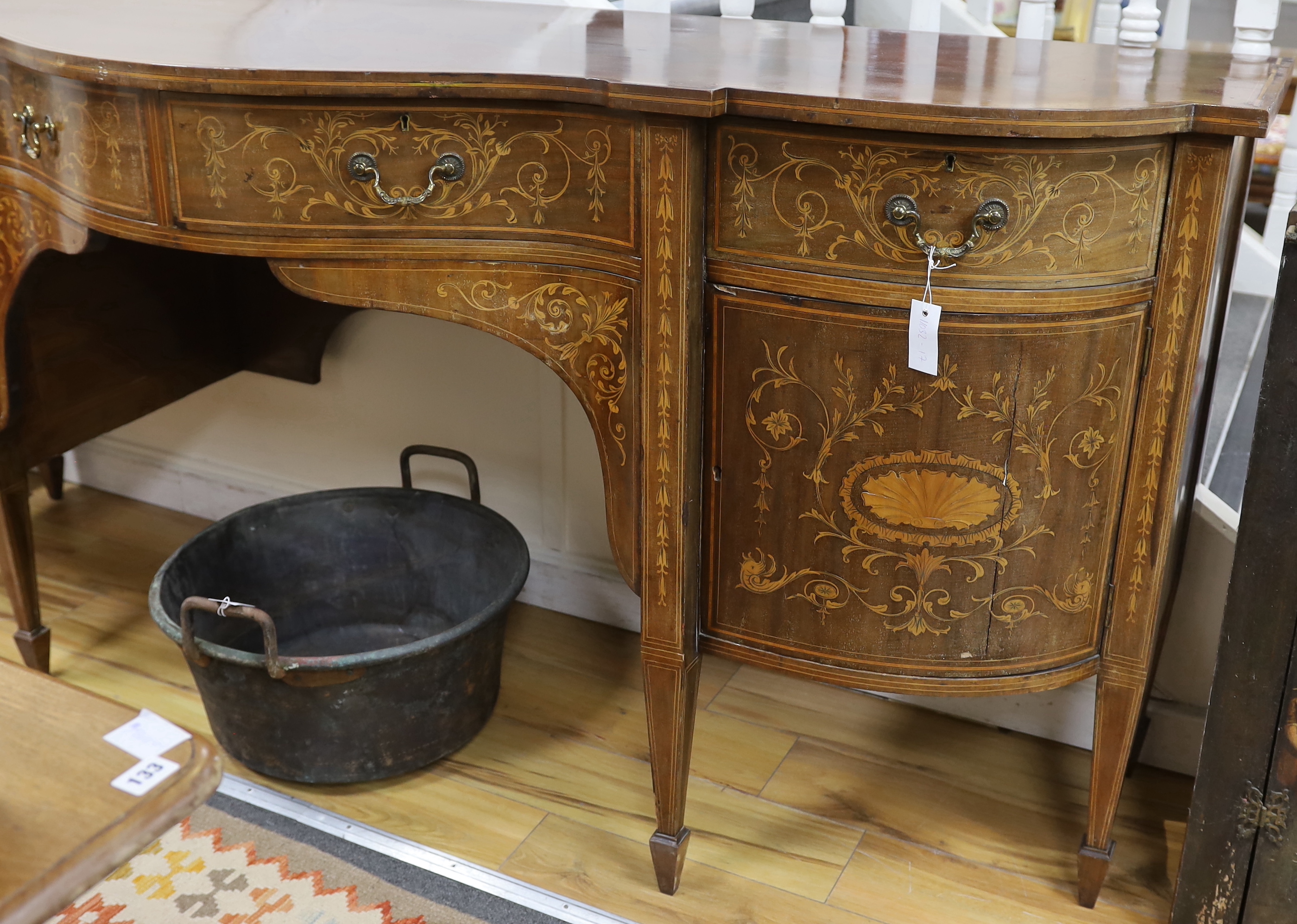 An Edwardian marquetry inlaid mahogany bow front sideboard, width 215cm, depth 73cm, height 95cm